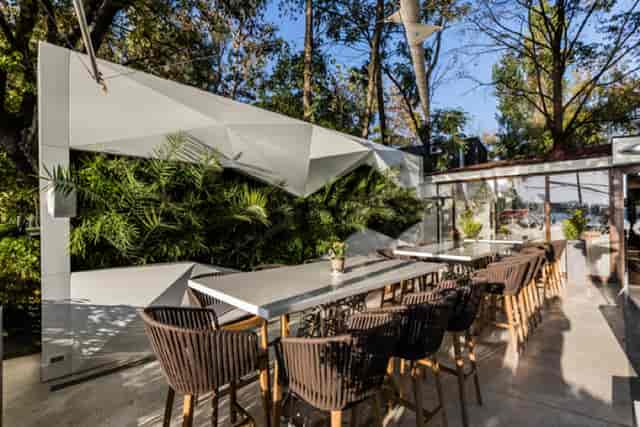 Modern outdoor dining room for upscale corporate networking reception and breakout session.