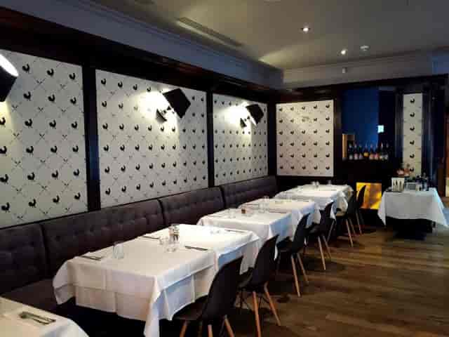 Gallo Nero restaurant dining room with white-tablecloth banquette seating for corporate events.