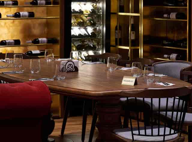 Private boardroom at Hanu' lui Manuc: polished wooden table for exclusive events and VIP dinners.