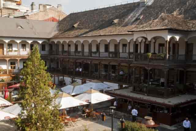 Voivodal Hall at Hanu' lui Manuc: historic outdoor wedding reception venue with architectural charm.