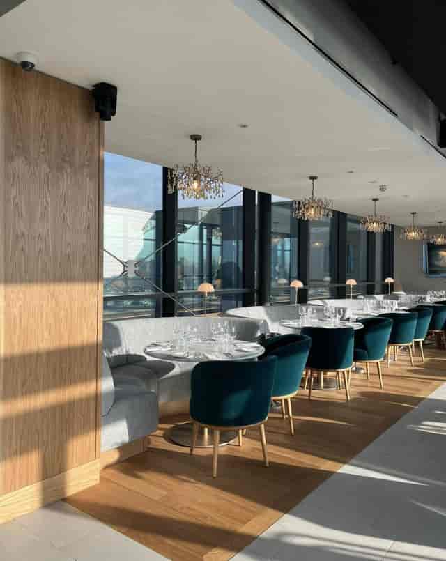 Contemporary private dining room with velvet chairs, ideal for upscale corporate events or dinners.