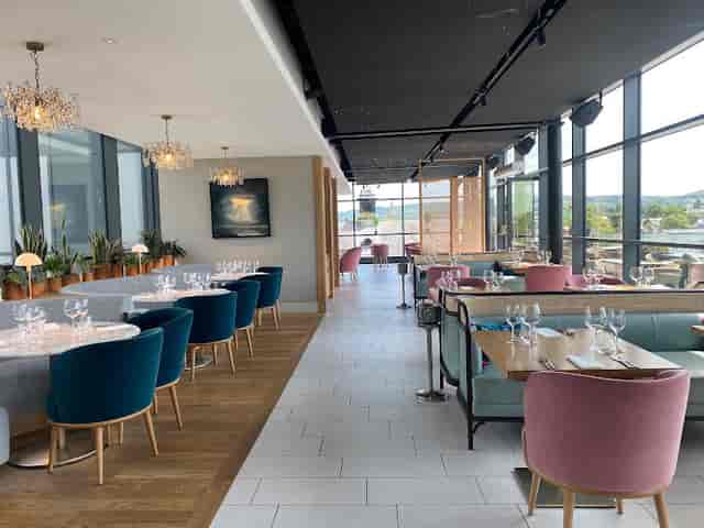 Upscale Nook On Five restaurant with floor-to-ceiling windows for corporate events and dinners.