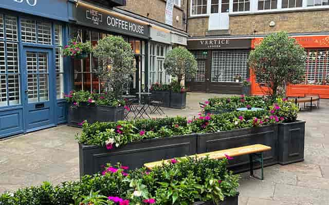 Outdoor plaza cafe for networking receptions and experiential pop-up event space.