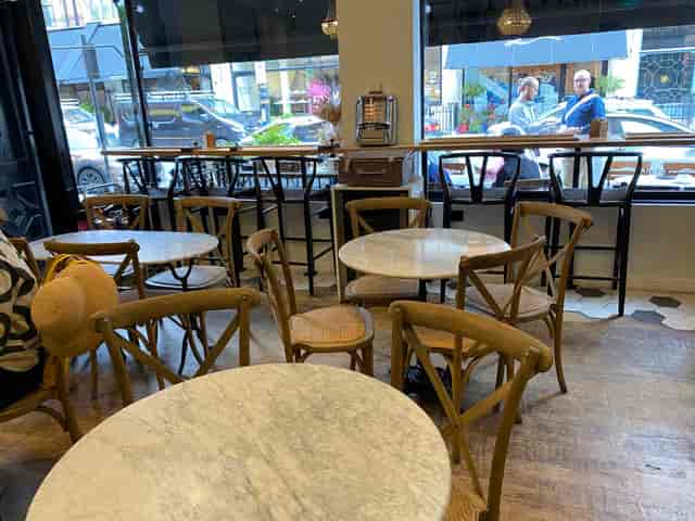 Café interior with bistro seating for casual networking and corporate events.