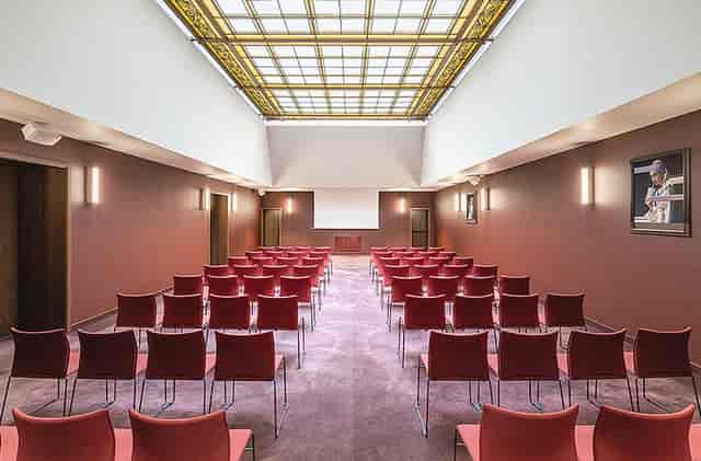Vienna Ballroom theater-style setup with architectural skylight for premium corporate meetings.