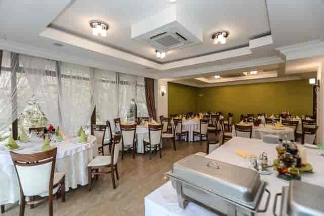 Main Hall banquet setup at Pensiunea Casa Maria for corporate events and formal social dining.