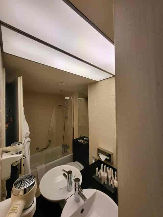 Ramada Plaza Bucharest executive hotel bathroom for business travel or corporate event accommodation.