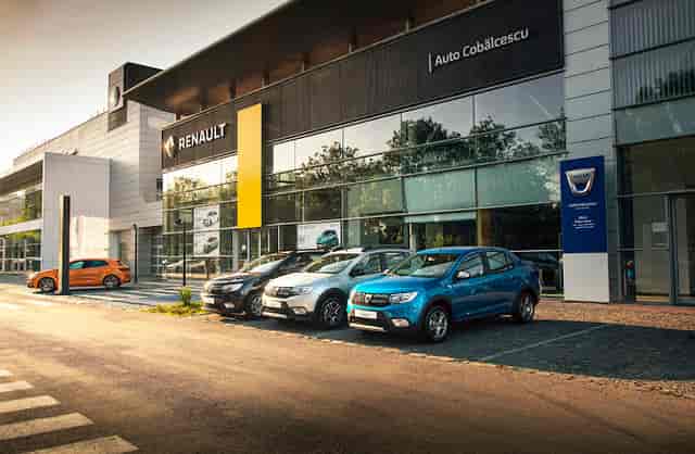 Modern Dacia dealership showroom for industrial-chic product launches and corporate events.