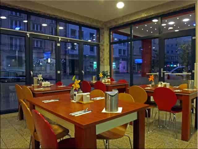 Functional meeting room in Atlas City Hotel Munich for casual networking and business events.