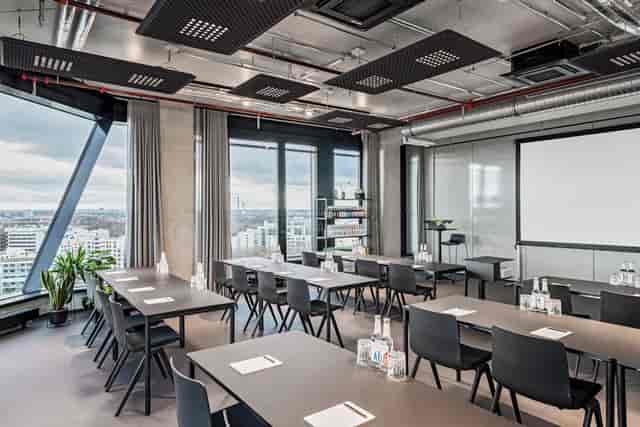 Modern meeting room with natural light for corporate workshops and seminars at Atlas City Hotel.