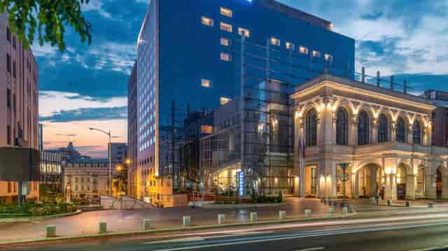 Winestone venue in Novotel Bucharest, sleek glass facade for events and gatherings.