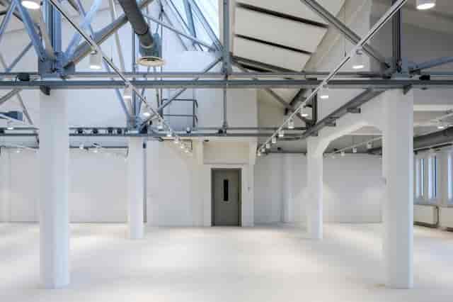 Industrial-chic HNK Amsterdam event space, versatile blank canvas for product launches and galas.