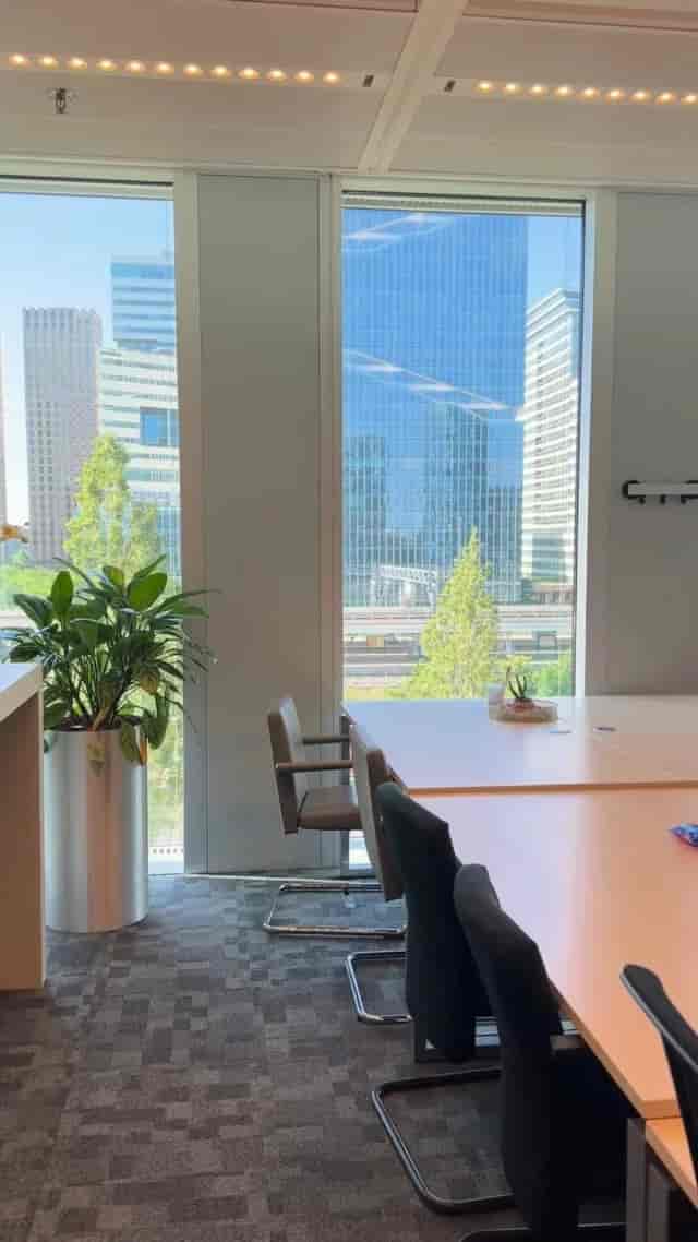 Sunlit breakout room at WTC Amsterdam for executive strategy sessions and meetings.