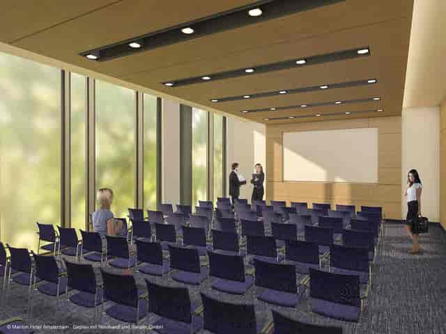 Modern boardroom with glass walls set for corporate workshops and executive briefings.