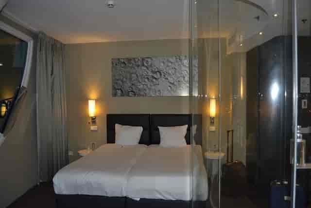 Modern Fletcher Hotel Amsterdam room with split beds for corporate travel and business events.