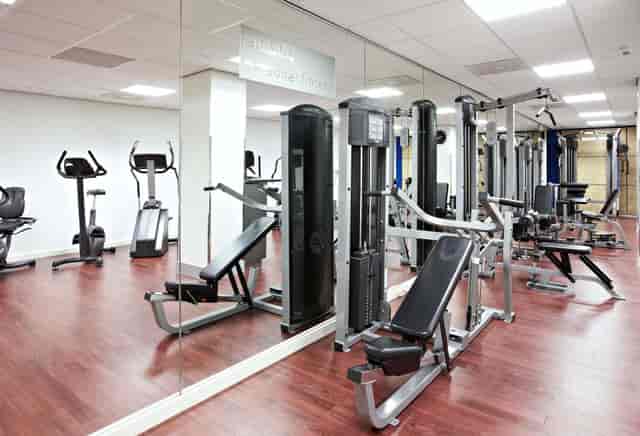 Hotel fitness center for conference events with modern gym equipment for attendee well-being.
