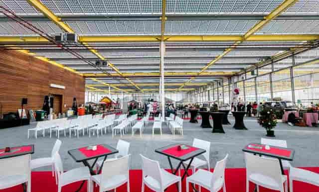 Industrial-chic auditorium at EXPO Greater Amsterdam for corporate events and networking.