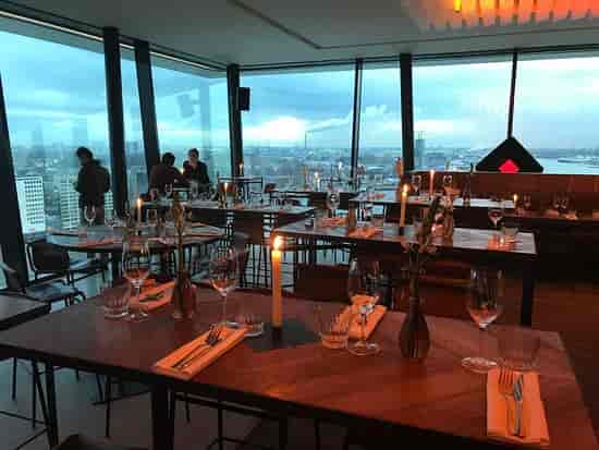 Upscale Amsterdam restaurant with panoramic views for corporate dinners and networking events.