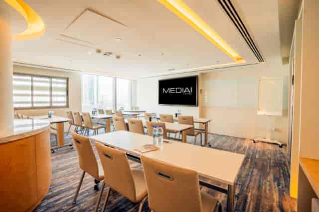 Modern boardroom with AV technology for professional training and collaborative workshops.