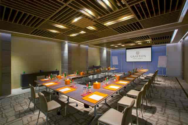 Modern boardroom with U-shape seating at Grayton Hotel Dubai for executive meetings and workshops.