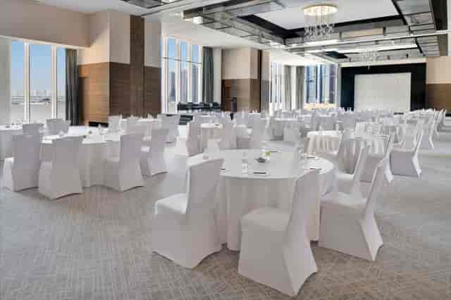 Luxury JW Marriott Marina ballroom with floor-to-ceiling windows for gala dinners and conferences.