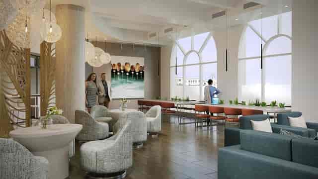 Grand Ballroom lounge with natural light for corporate events and social networking.