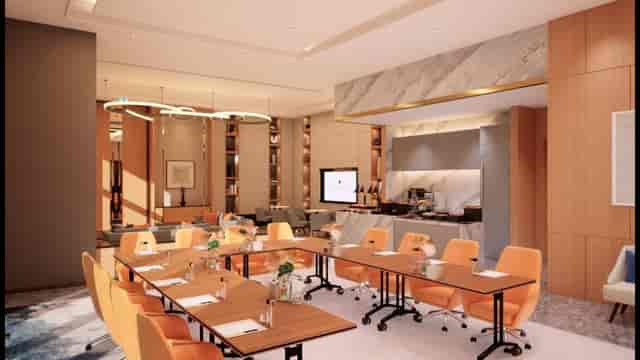 U-shape boardroom with orange ergonomic seating at Address Montgomerie for executive meetings.