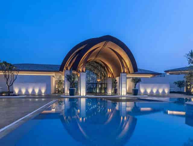 Aleka luxury resort entrance at twilight for incentive trips and corporate retreats.