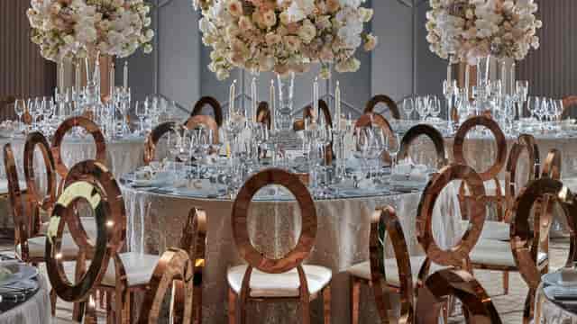 Mandarin Oriental Dubai ballroom with rose gold chairs for a luxury gala and corporate event.