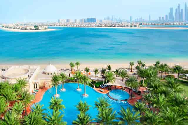 Luxury Kempinski Palm Jumeirah beach resort with pool for corporate retreats and executive off-sites.