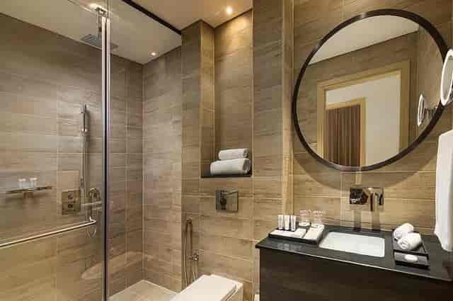 Modern luxury hotel bathroom at Topaz Millennium Al Barsha for VIP conference guest accommodations.