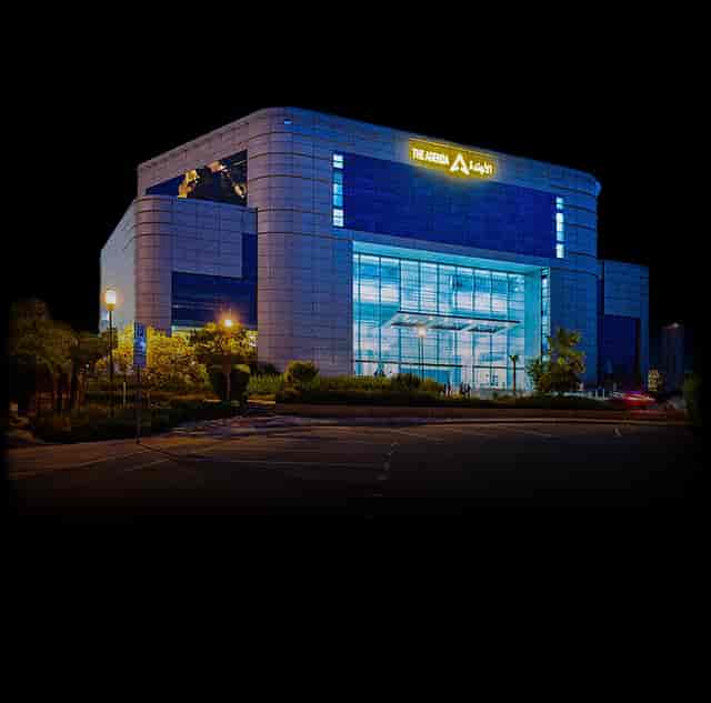 Modern glass conference center at The Agenda, ideal for corporate events and evening galas.