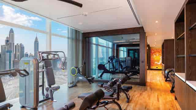 Modern hotel fitness center at Taj Jumeirah Lakes Towers for corporate incentive wellness events.