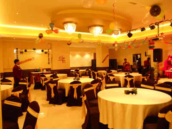 Oud Metha ballroom banquet hall with gold-sashed chairs for social events and party celebrations.