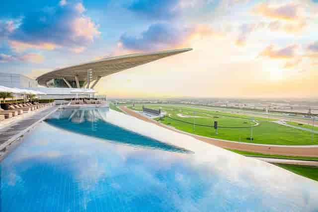 Meydan Hotel rooftop infinity pool for high-end corporate events and networking receptions.