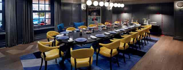 Elegant dining room at Kimpton De Witt, ideal for intimate gatherings and business meetings.