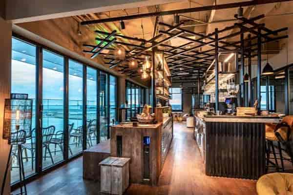 Stylish bar area in Four Elements Hotel Amsterdam, ideal for networking events and meetings.