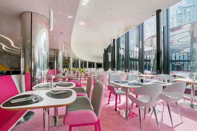 Modern event space at Park Inn Amsterdam with vibrant colors, ideal for corporate gatherings.