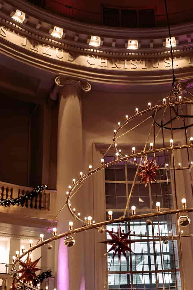 Elegant event space in Koepelkerk Amsterdam with starry chandelier, perfect for gatherings.