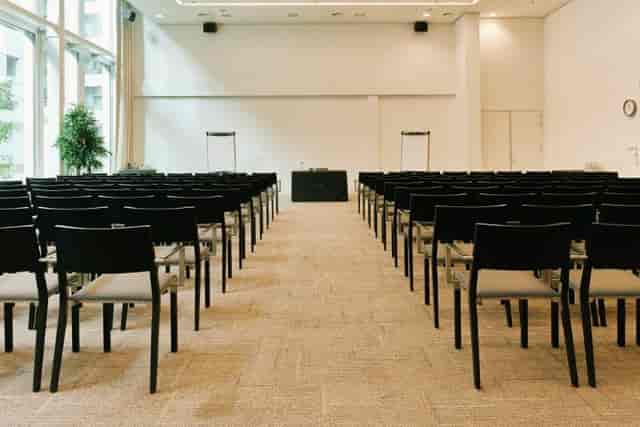 Convention center at Hotel Casa Amsterdam with black chairs for workshops and conferences.