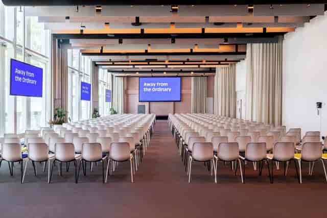 Conference room at Hotel Casa Amsterdam with modern chairs for presentations and events.