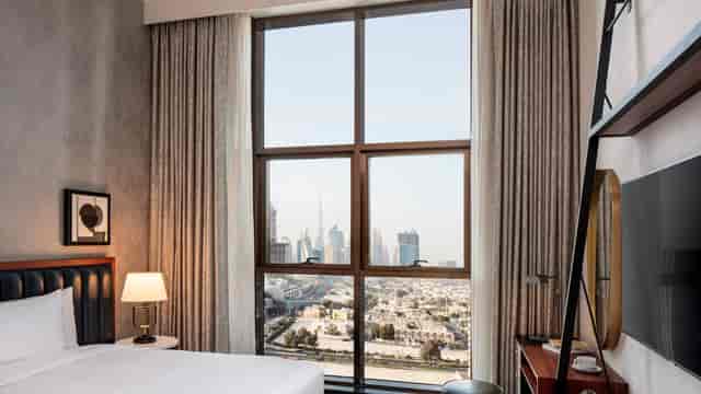 Modern hotel room with skyline view, perfect for business events in Dubai.