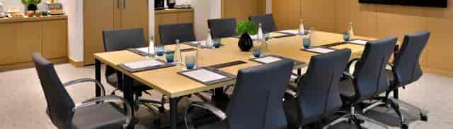 Professional boardroom setup at Avani Ibn Battuta Dubai Hotel for corporate meetings and events.