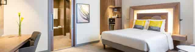 Modern Novotel Bur Dubai MAS meeting room with contemporary business facilities for corporate events.