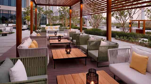 Modular lounge seating at Origins, Vida Emirates Hills for corporate networking and receptions.