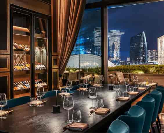 Private dining room with skyline view, ideal for executive dinners and VIP networking events.