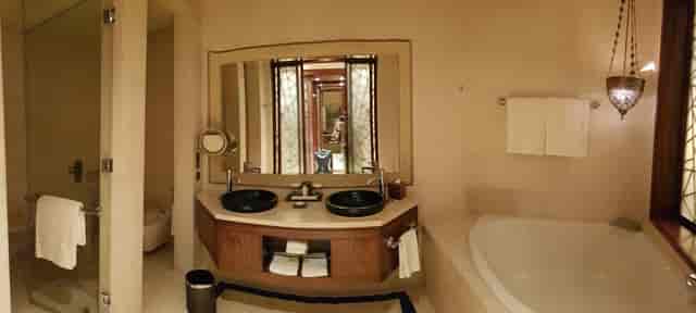 Luxury hotel bathroom with dual-vanity at Karnak, Raffles Dubai for VIP event and wedding booking.