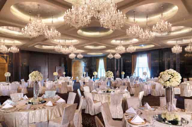 Luxury ballroom at Raffles Dubai with crystal chandeliers for weddings and gala events.