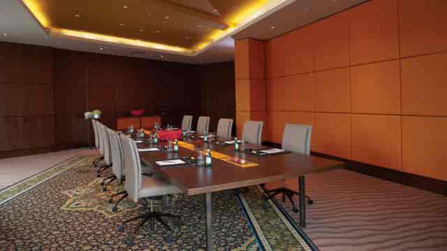 Boardroom at Jumeirah Creekside Hotel with long table for professional executive meetings.
