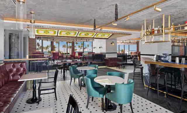 High-end lounge at JA Beach Hotel for corporate breakout sessions and networking events.